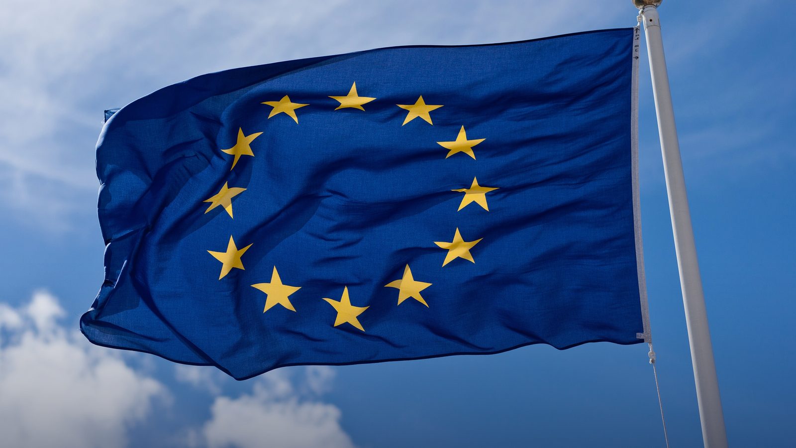 The flag of the European Union against a blue sky